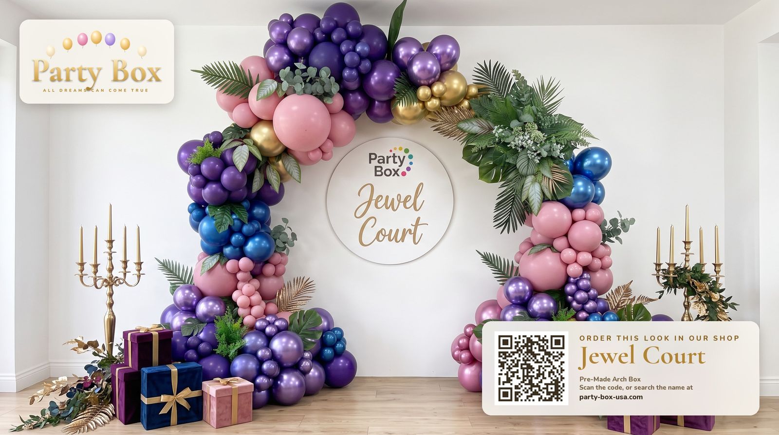 Jewel Court balloon arch: amethyst purple, sapphire blue and rose balloons with gold chrome accents, palm leaves and gold candelabras
