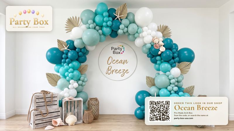 Ocean Breeze balloon arch: teal, aqua and white balloons with dried palm fronds, starfish and seashells for a coastal beach party