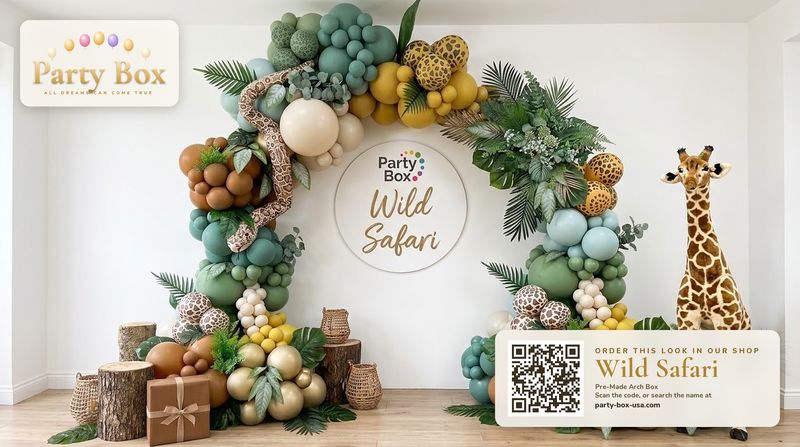 Wild Safari balloon arch: sage green, sand and caramel balloons with leopard and giraffe print balloons, tropical leaves and a plush giraffe