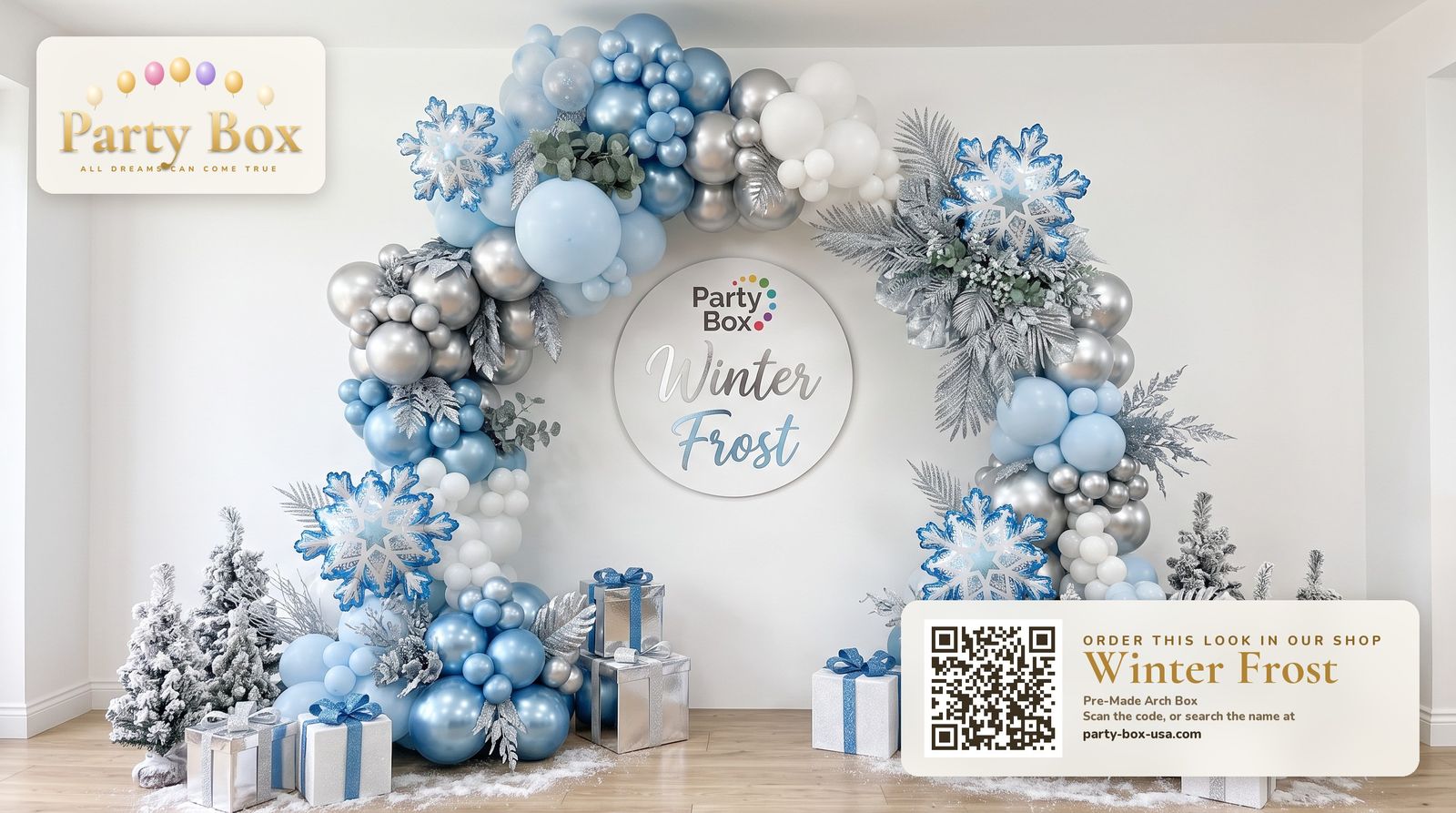 Winter Frost balloon arch: icy blue, silver chrome and white balloons with snowflake balloons, frosted greenery and flocked mini trees